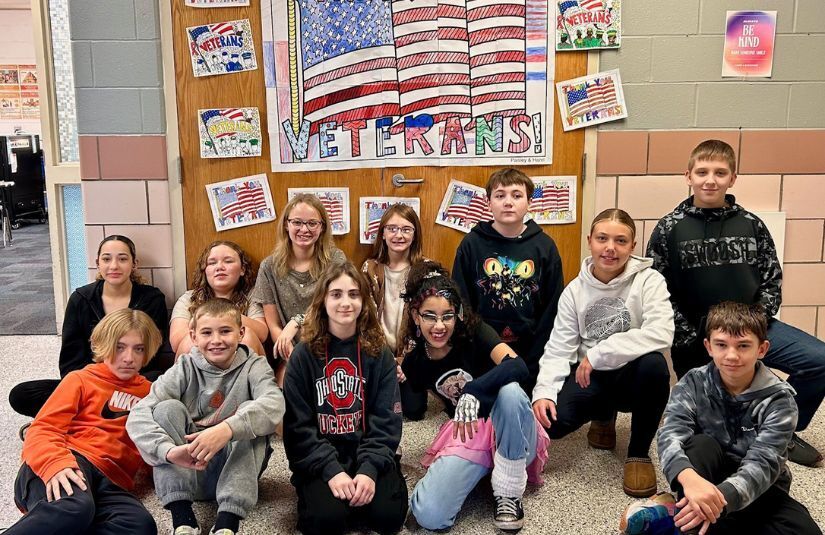 WMs students in front of their veterans day display